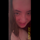 Emi squats on a wooden floor facing the camera and spreads herself wide as her turds fall out onto the floor. She picks them up in her hand and drops them in the toilet. Vertical format video. Over 2 minutes.